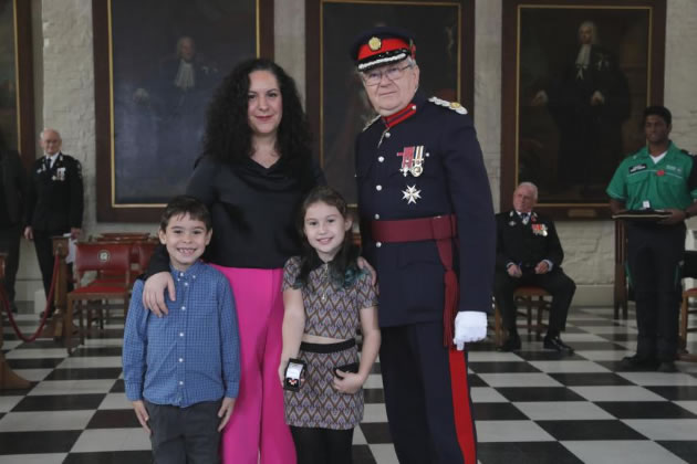 Chris Streat's widow Maria and the couple&rsquo;s two children, Rosalita and Santino, accepting the Order of St John on his behalf