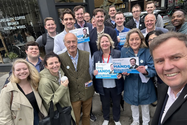 Greg Hands (right) with his supporters in the constituency 
