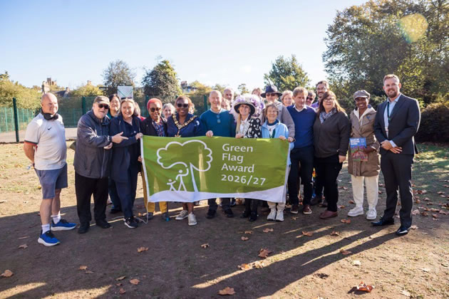 L-R: Friends and residents join Cllr Bora Kwon, H&F Cabinet Member for Environment, Arts and Culture (back row), Cllr Nicole Trehy, H&F Cabinet Member for Climate Emergency and Travel (front row), and H&F Mayor Cllr Sharon Holder at flag raising