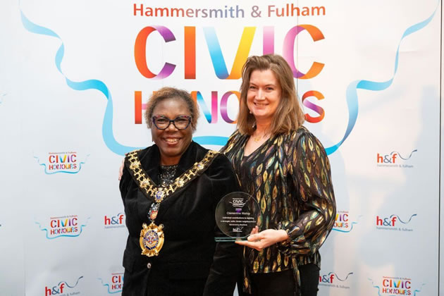 Playgrounds campaigner Clementine Wallop receives her award from the Mayor of Hammersmith and Fulham, Cllr Sharon Holder